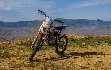 Sports motorcycle on a background of mountains