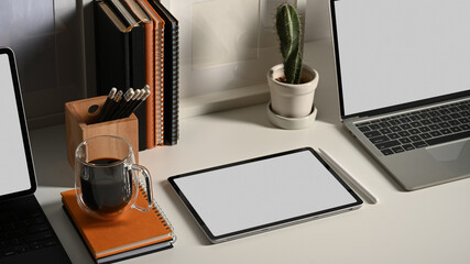 Worktable with tablet, laptop and stationery in home office, include clipping path