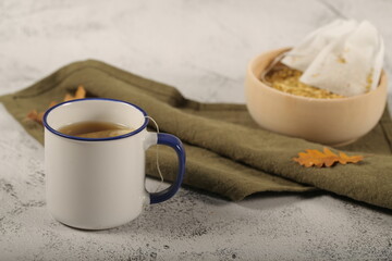 dry chamomile tea bags are on the table	
