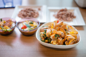 stir fried spicy clams shell with basil leaves
