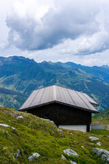 mountain hut in the mountains, landscape in the austrian mountains, swiss alpine village, alpine hut in the mountains, house in the mountains