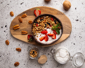 Granola yogurt with strawberries and chia seeds