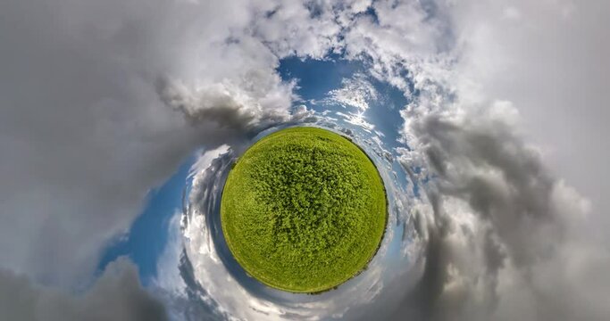 revolves among fields with beautiful fluffy clouds. Tiny planet Transformation with curvature of space. loop rotate
