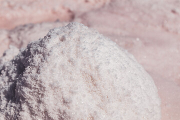 Pink salt bunch close-up shining on coast of salt lake. Spa recreation on  Syvash or Sivash, the...