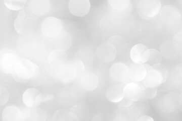 Obraz premium A brilliant white background with circles and ovals. Template for a holiday card with bright and sparkling lights.