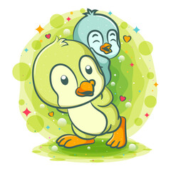 Two penguins play together on the grass
