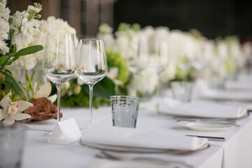 empty wine glasses set up for dinner