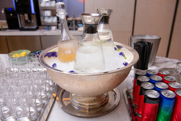 Fototapeta na wymiar bottles of different refreshment in ice cooler bucket