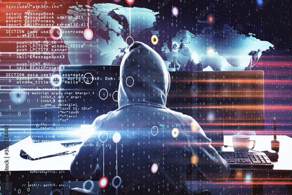 Poster Hacker at desktop using computer and glowing world map