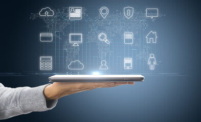 Hand holding tablet with cloud computing hologram.