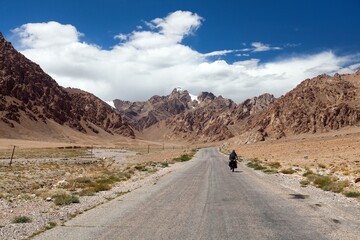 Pamir highway or pamirskij trakt with biker