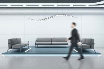 Businessman walking in modern waiting room