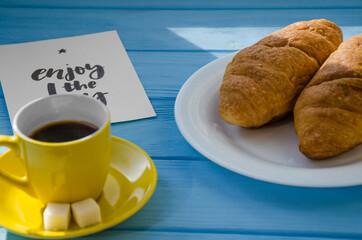 still life of cake with cup of coffee highlighted by sunlight