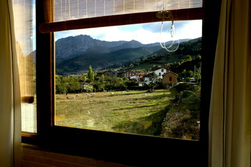 looking through a window to a beautiful view of rural landscape in north Spain