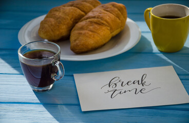 still life of cake with cup of coffee highlighted by sunlight