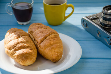 still life of cake with cup of coffee highlighted by sunlight