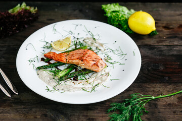 Baked salmon with asparagus and sauce