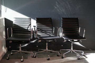 Discarded office chairs in a corner