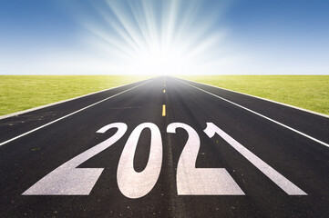 2021 road perspective with rising sun, new year card