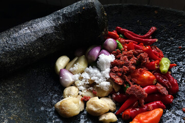 Close up of Indonesian traditional spices on stone mortar