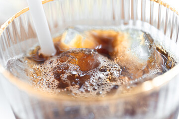 iced americano and ice cube in a Cup