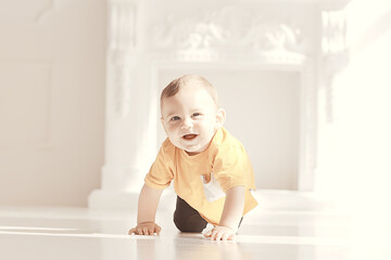 toddler child in a bright studio / little boy infant beautiful healthy child