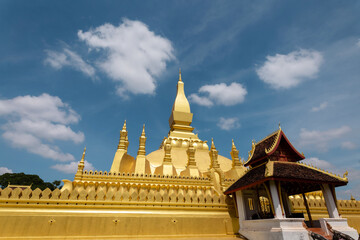 Fototapeta na wymiar Pha That Luang Vientiane Golden Pagoda in Vientiane, Laos. sky background beautiful.