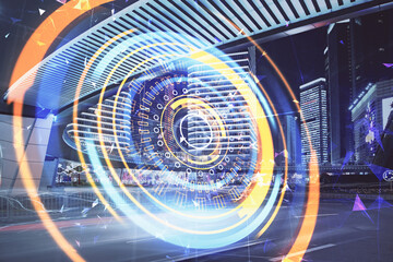 Double exposure of technology theme hologram and cityscape background. Concept of Hightech.