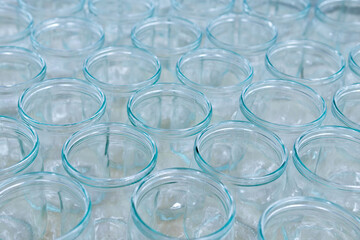 Many empty glass jars without lids of different sizes-empty jars for jam, honey, jam
