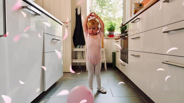 Ballerina Toddler in Home Kitchen with Rose Petals Falling