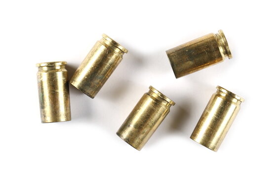 9mm pistol bullet casings isolated on white background, top view