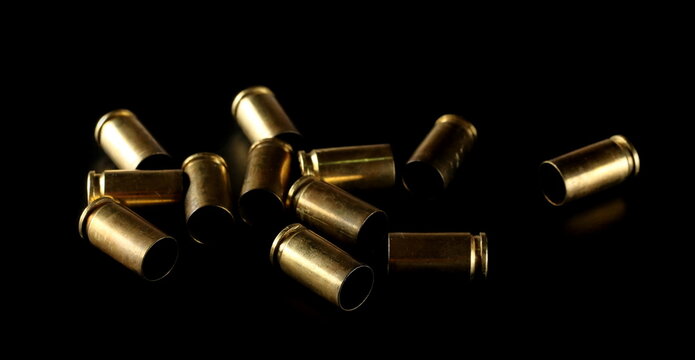 9mm pistol bullet casings isolated on black background