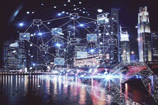 Double exposure of envelop hologram flying from gadget and city view background. Concept e-mail.