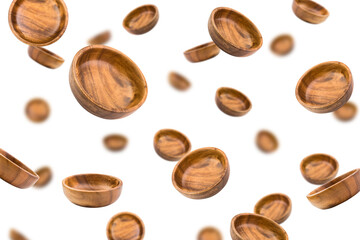 Falling wooden plate, bowl, isolated on white background, selective focus