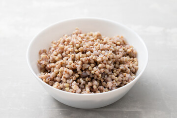 boiled green buckwheat in white bowl