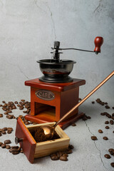 selective focus. manual retro coffee bean mill. dark wood on a light gray background. with Cafe written in metal letters