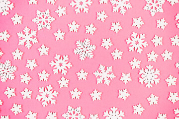 Top view of winter ornament made of white snowflakes on colorful background. Happy New Year concept with copy space