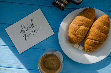 still life of cake with cup of coffee highlighted by sunlight