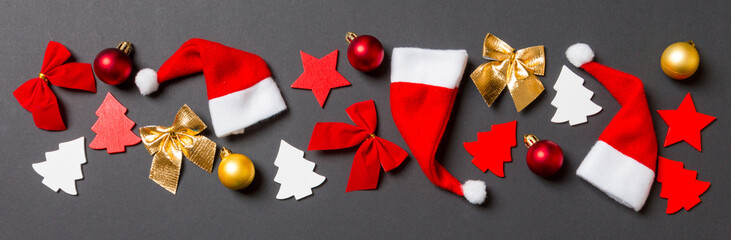 Top view Banner of black background with New Year toys and decorations. Christmas time concept with copy space