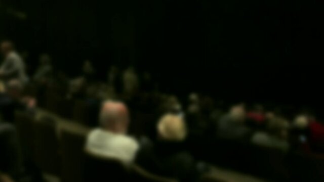 Spectators in the theater auditorium before the performance. Blurred view. 4K