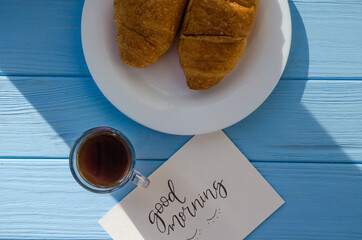 still life of cake with cup of coffee highlighted by sunlight