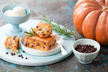 Homemade paleo cassava flour slice cake with pumpkin and chocolate chips, selective focus