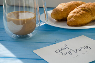 still life of cake with cup of coffee highlighted by sunlight
