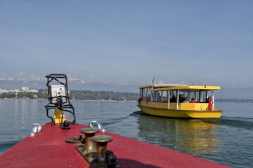 Fototapeta na wymiar famous yellow boats on the lake in Geneva, Switzerland