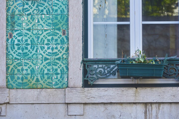 facade covered with azulejos in street of Bairro Alto district in Lisbon, Portugal