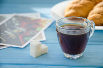 still life of cake with cup of coffee highlighted by sunlight