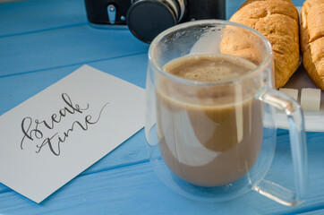 still life of cake with cup of coffee highlighted by sunlight