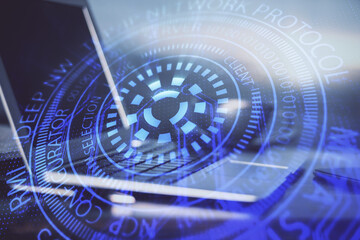 Double exposure of desktop computer and technology theme hologram. Concept of software development.