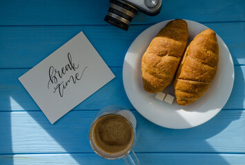 still life of cake with cup of coffee highlighted by sunlight