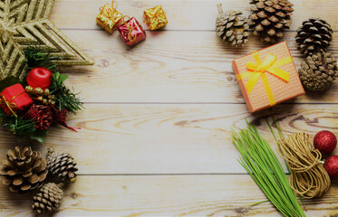 Christmas preparations, decorations on rustic wooden boards, central space for text or idea